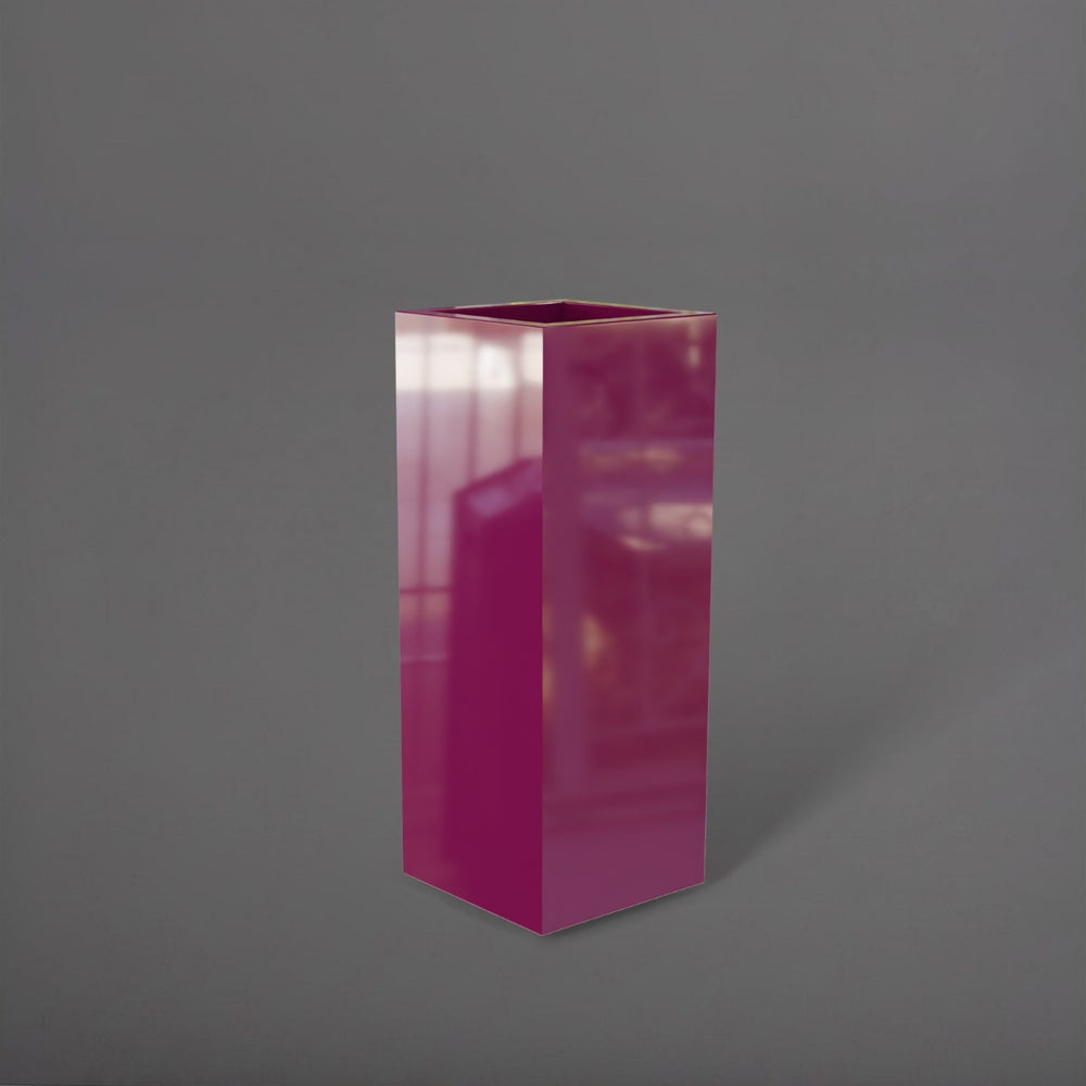 Delray Tall Corner Fiberglass Planter in gloss eggplant against gray background.