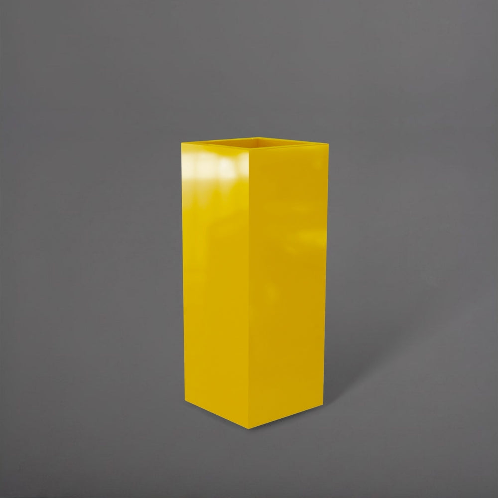 Delray Tall Corner Fiberglass Planter in gloss saffron against gray background.