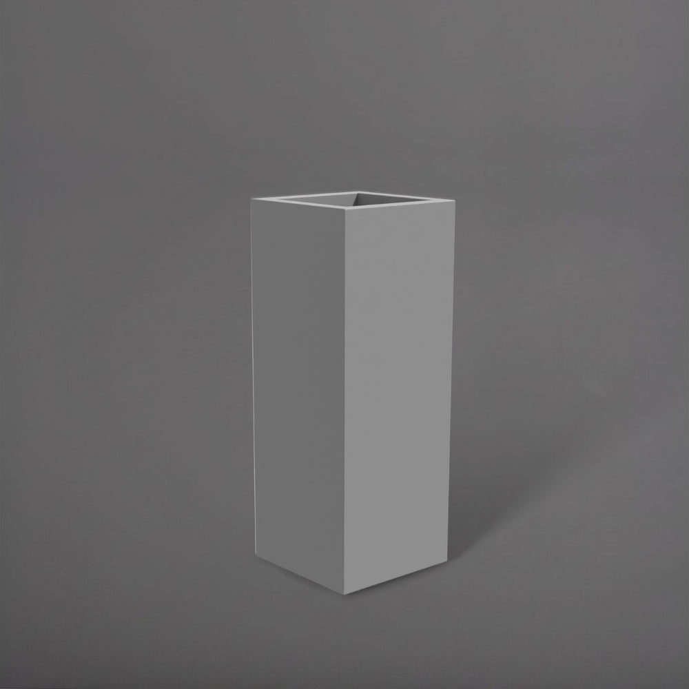 Delray Tall Corner Fiberglass Planter in matte cement grey against gray background.