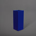 Delray Tall Corner Fiberglass Planter in matte cobalt blue against gray background.