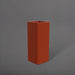 Delray Tall Corner Fiberglass Planter in matte terra cotta against gray background.