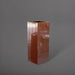 Delray Tall Corner Fiberglass Planter in metallic bronze against gray background.