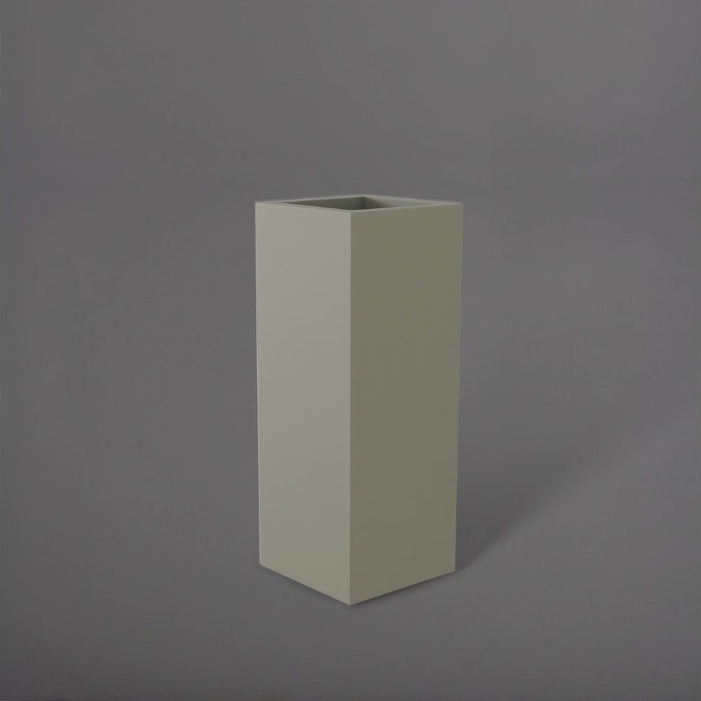 Delray Tall Corner Fiberglass Planter in satin beige against gray background.