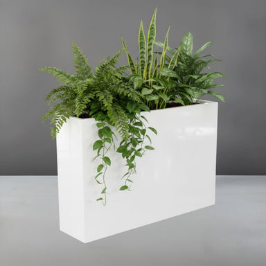 Delray Tall Rectangle Fiberglass Planter filled with plants against gray backdrop