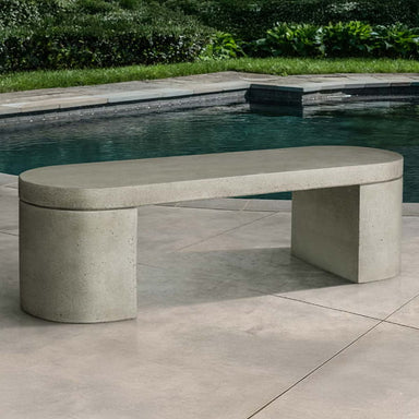 Dorchester Bench on concrete near a swimming pool.