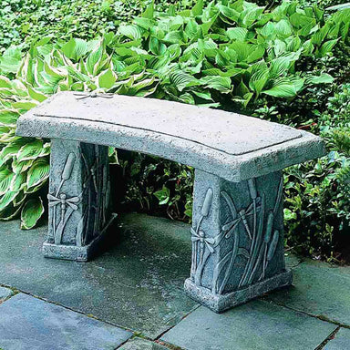 Dragonfly Curved Bench  on concrete in the backyard.