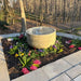 Echo Park bubbling fountain in raised flower bed on backyard patio