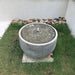 Echo Park Fountain in action on grass.