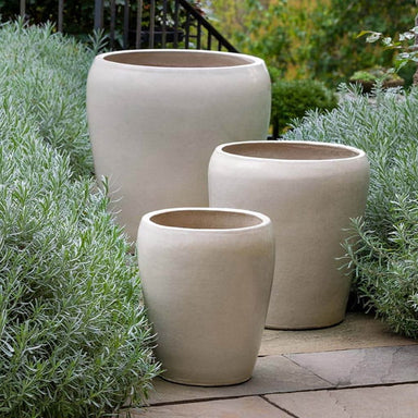 Ellesmere Planter - Cream - S/3 on concrete in the backyard.