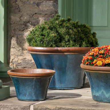 Enfield Planter Mediterranean S/3 filled with plants in the backyard