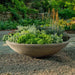 Enso Bowl 40 inch filled with plants in the backyard.