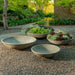 Enso Bowl with four different sizes on gravel in the backyard.