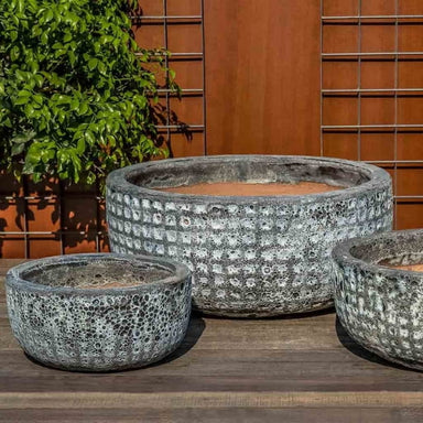 Escada Planter - Fossil Grey - Set of 3 on concrete in the backyard.