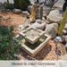 Escala Fountain on pebbles in action.