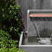Falling Water 2 Fountain on gravel in action upclose.