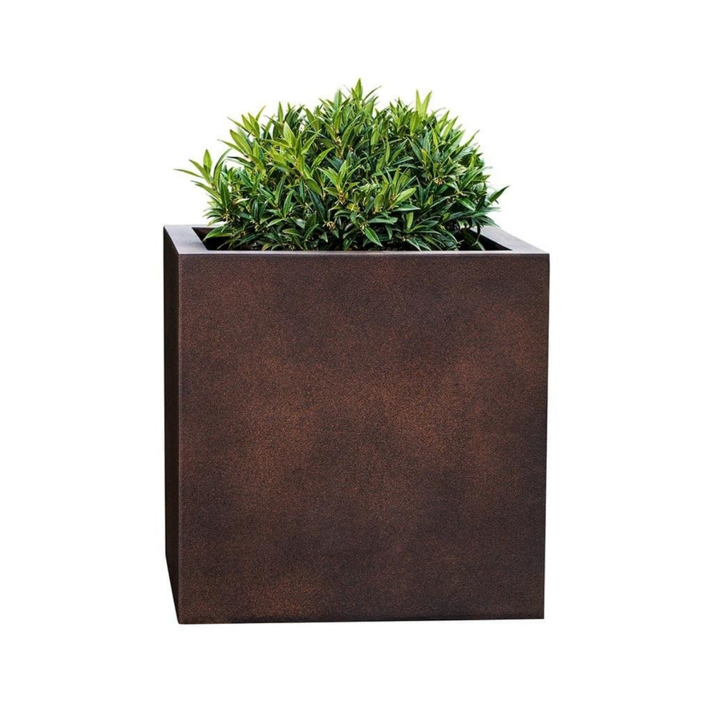 Farnley Planter 2828 S/1 in rust lite filled with plants against white background.