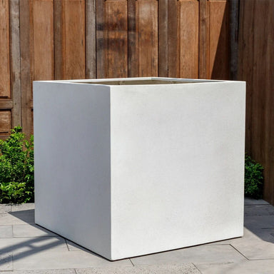Farnley Planter 3636 S/1 in quartz premium on concrete in the backyard.