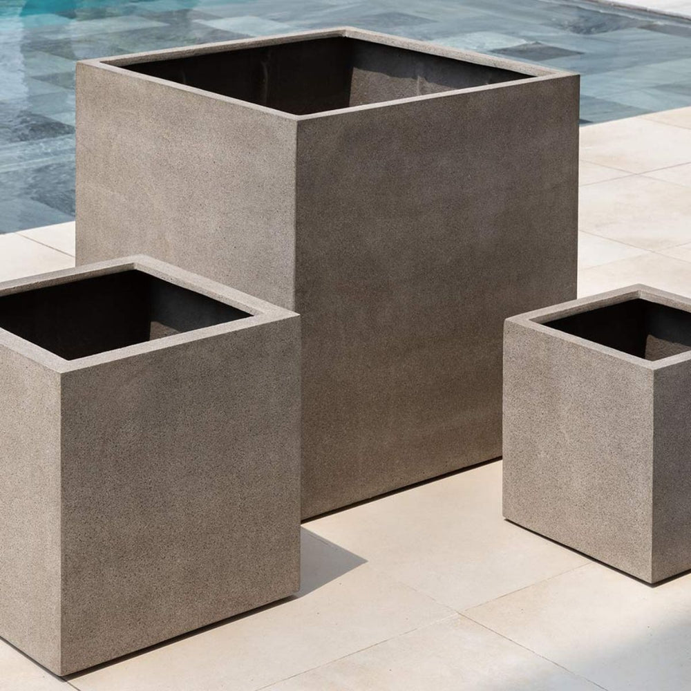 Farnley Planter 3636 S/1 in riverstone premium lite on concrete near swimming pool.