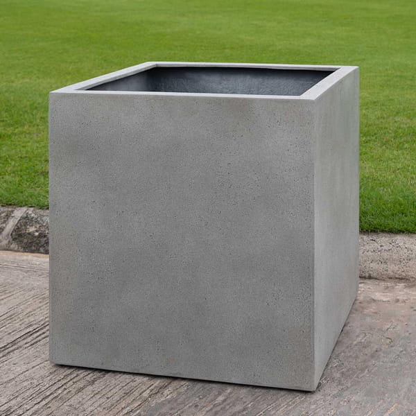 Farnley Planter 3636 S/1 in stone grey lite on concrete in the backyard.