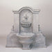 Flaminia Wall Fountain against gray background.