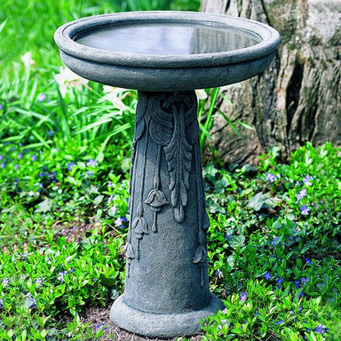 Flores Birdbath on leaves in the backyard