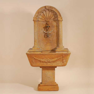 Foritalico Wall Fountain for Spout against brown background.