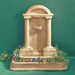 Foro Romano Fountain in action against green backdrop.