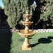 Gaetana Three Tier Fountain on grass in the backyard.