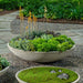 Garden Bowl, 36 Inch on gravel filled with plants.