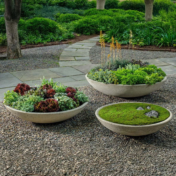 Garden Bowl shown in different sizes in the backyard.