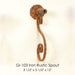 Gi-103 Iron Rustic Spout against brown background.