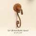 Gi-128 Iron Rustic Spout against brown background.
