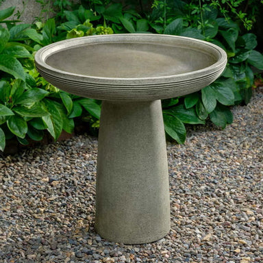 Giles Birdbath on gravel in the backyard.