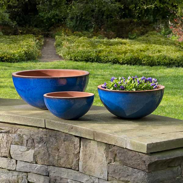 Glenside Bowl Planter - Riviera Blue - S/3 filled with purple flowers in the backyard