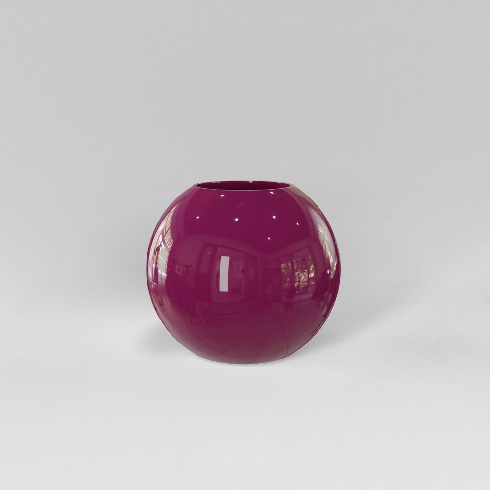 Globe Fiberglass Planter in gloss eggplant against gray background.