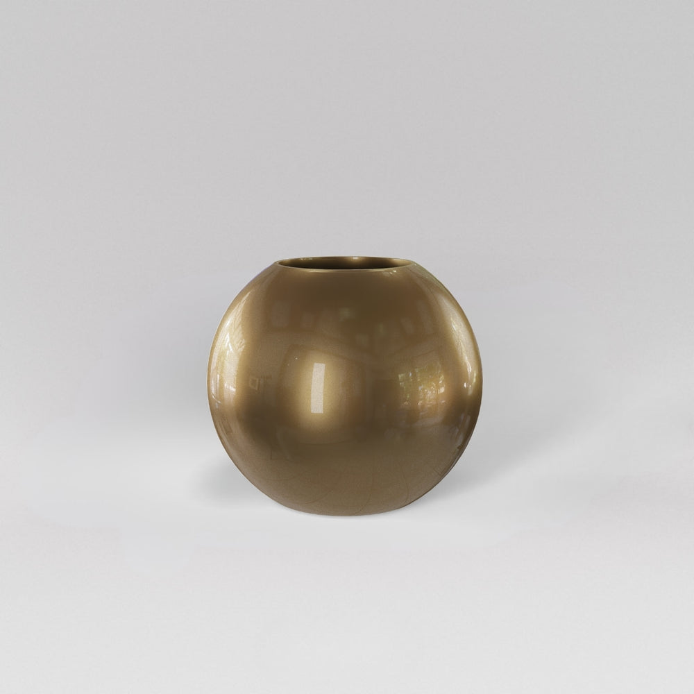 Globe Fiberglass Planter in gloss metallic gold against gray background.