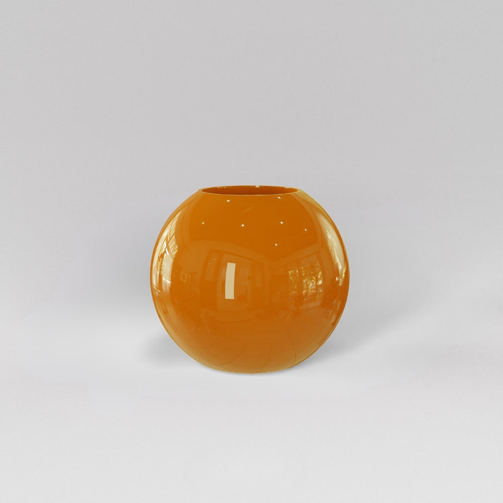 Globe Fiberglass Planter in gloss tangerine against gray background.