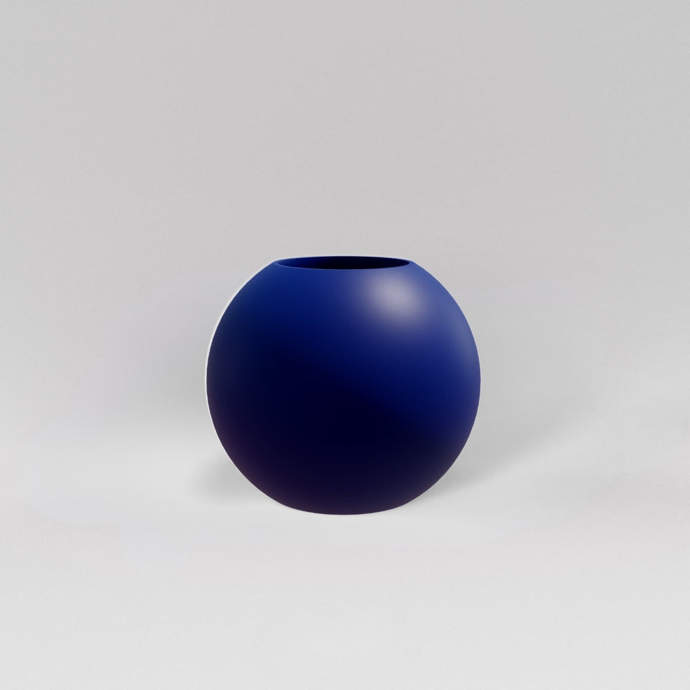 Globe Fiberglass Planter in matte cobalt blue against gray background.