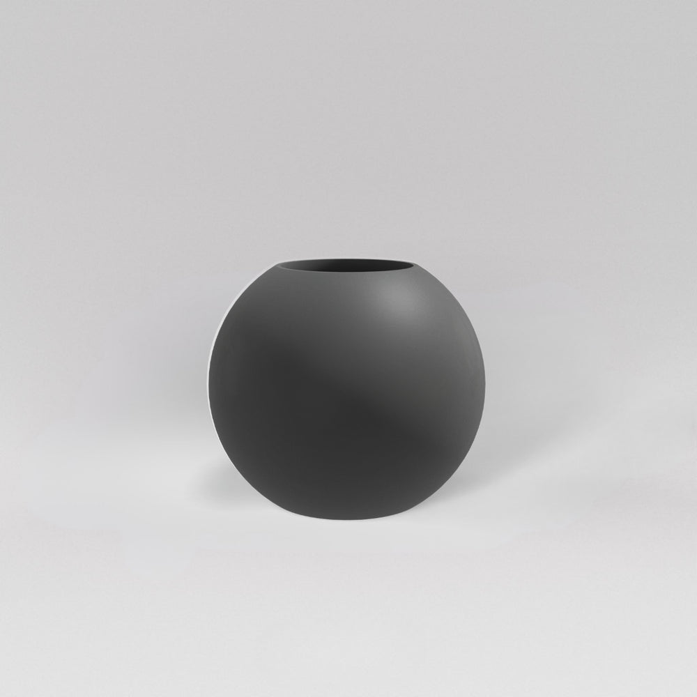 Globe Fiberglass Planter in matte gunmetal against gray background.
