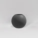 Globe Fiberglass Planter in matte gunmetal against gray background.