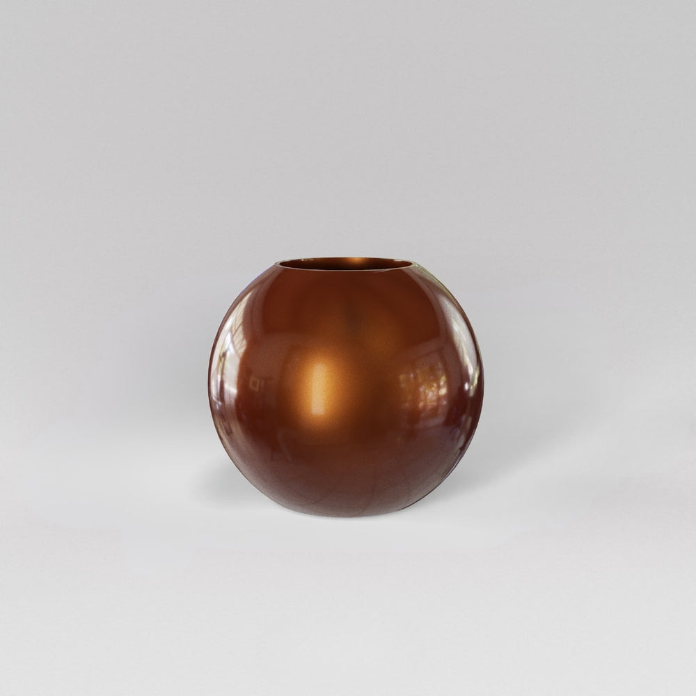 Globe Fiberglass Planter in metallic bronze against gray background.