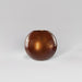 Globe Fiberglass Planter in metallic bronze against gray background.