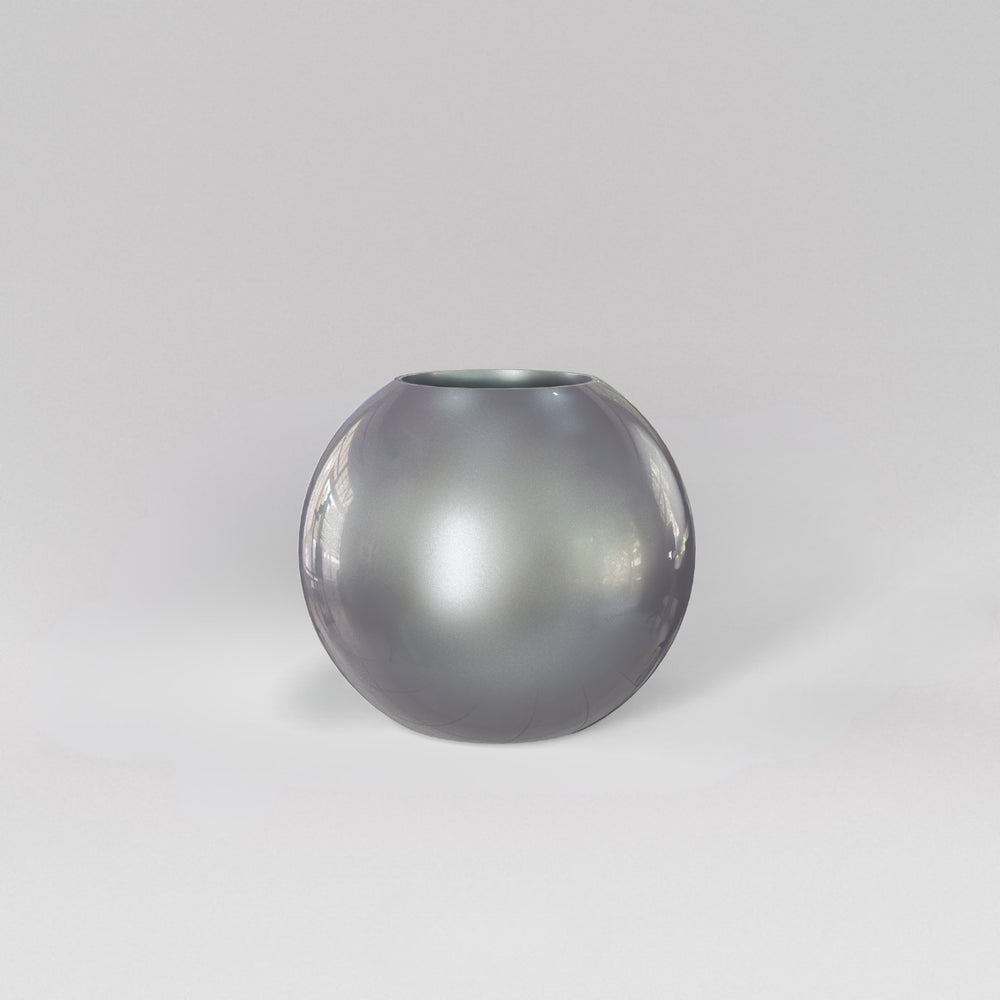 Globe Fiberglass Planter in metallic silver against gray background.