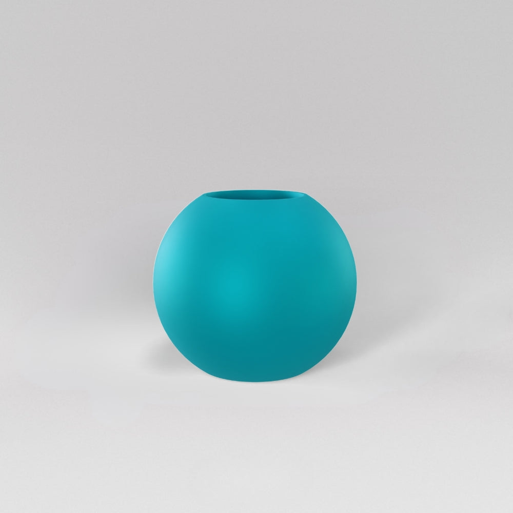 Globe Fiberglass Planter in satin seafoam green against gray background.