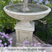 Gramercy Fountain in action beside purple flowers.