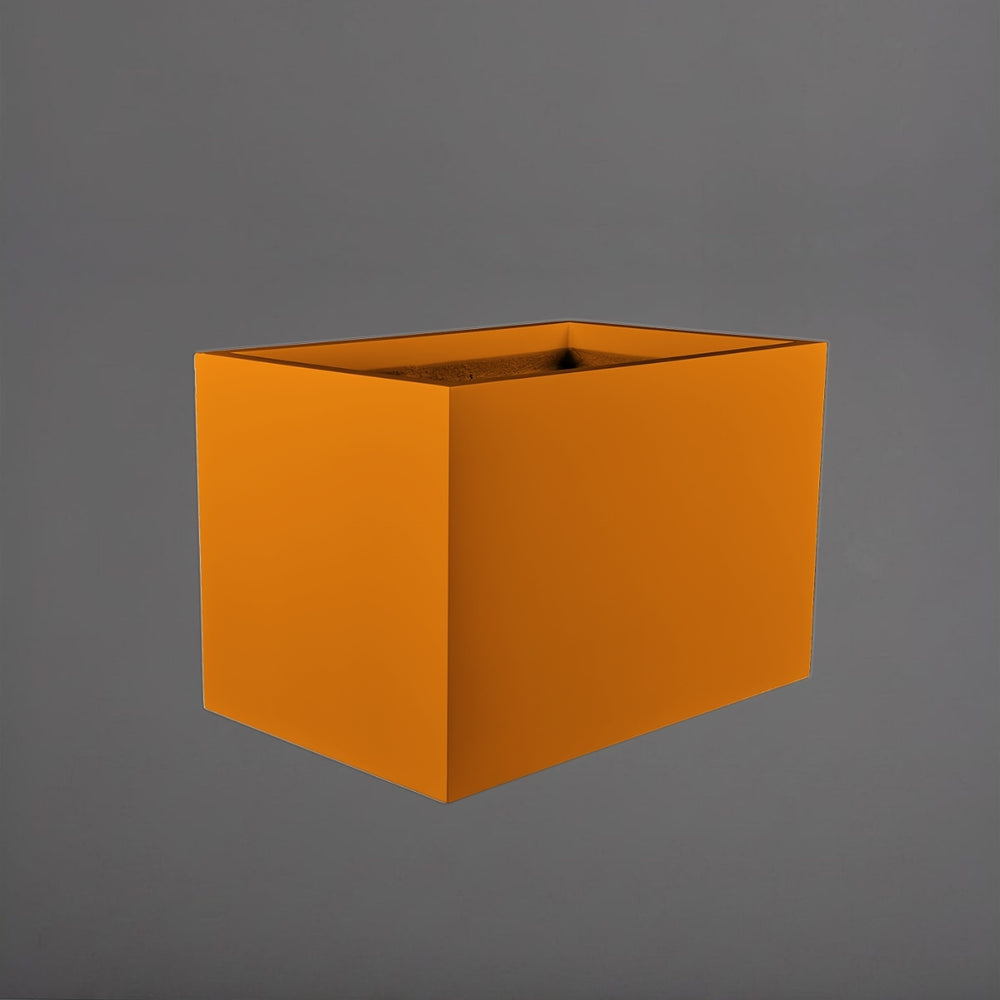 Granada Wide Rectangle Fiberglass Planter in gloss tangerine against gray background.
