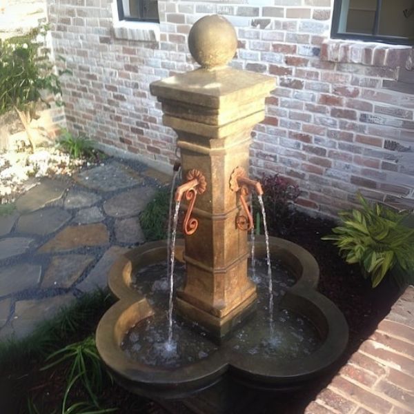 Grand Avignon Courtyard Fountain shown in antico color in action.