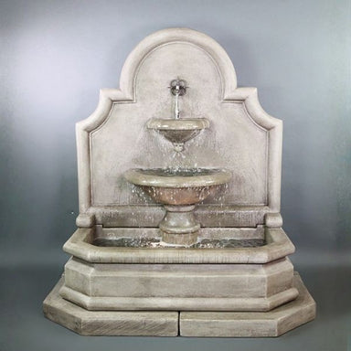 Grand Venasque Wall Fountain against gray background.