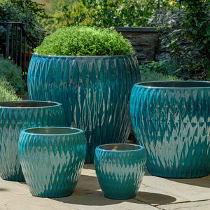 Harlequin Planter - Blue Jade - S/5 on concrete in the backyard
