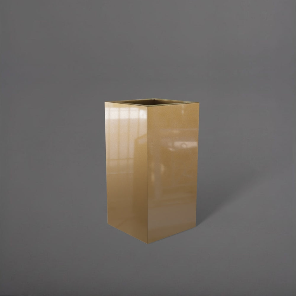 Hollywood Corner Fiberglass Planter in gloss metallic gold against gray background.